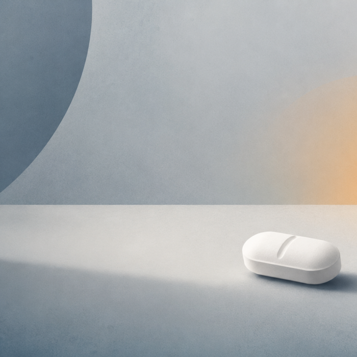 white prescription pill on a neutral surface illustrating an article about fentanyl abuse