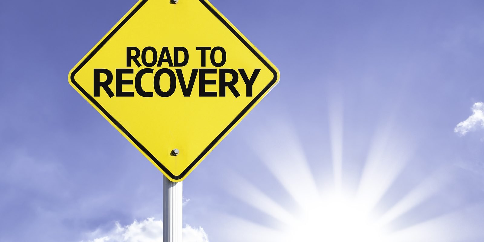 Road To Recovery road sign with sun background for suboxone rehab