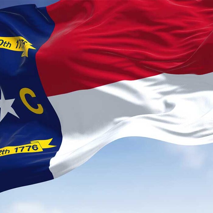 Close-up view of the North Carolina state flag waving. Representing North Carolina Rapid Detox
