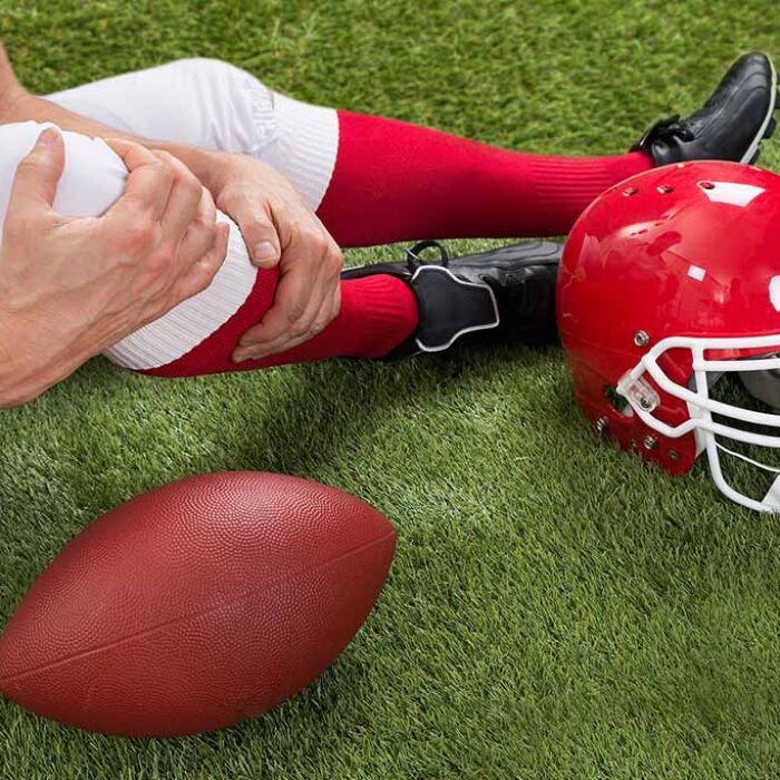 Close-up of injured american football player on the field, concept of opioid addiction in sports