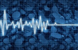 drug overdose epidemic; heartbeat line with opioids background