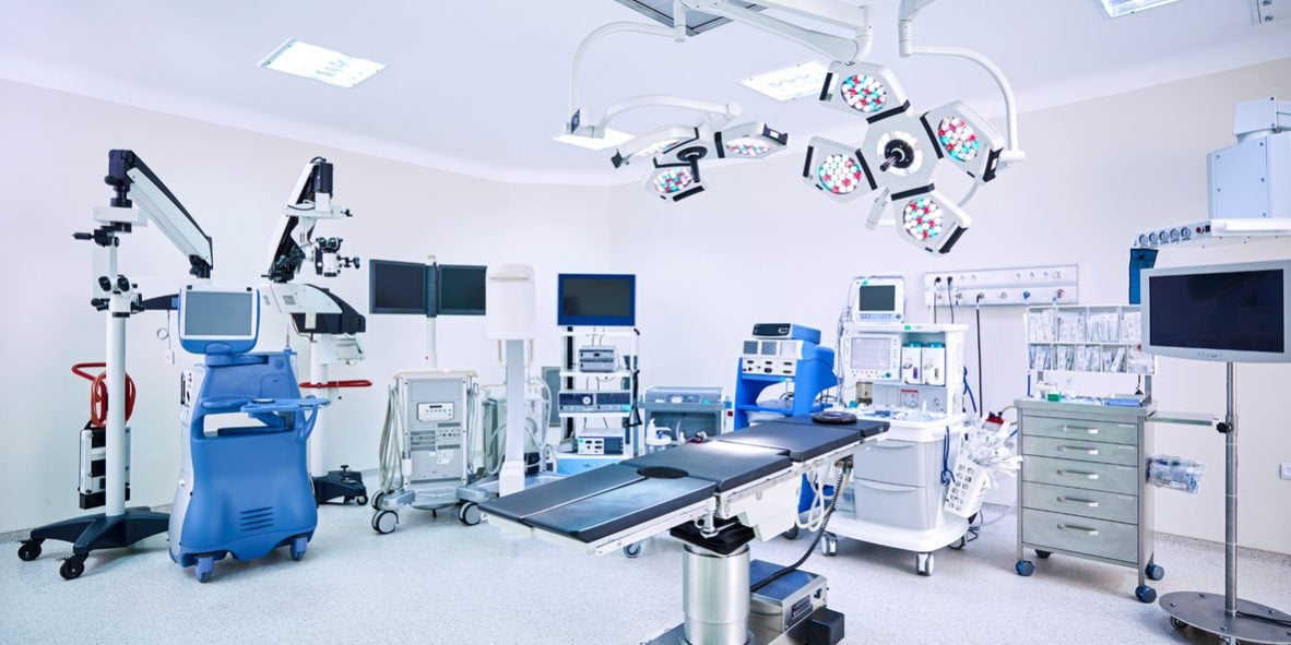 ICU - intensive care unit operating room with medical equipment setup.