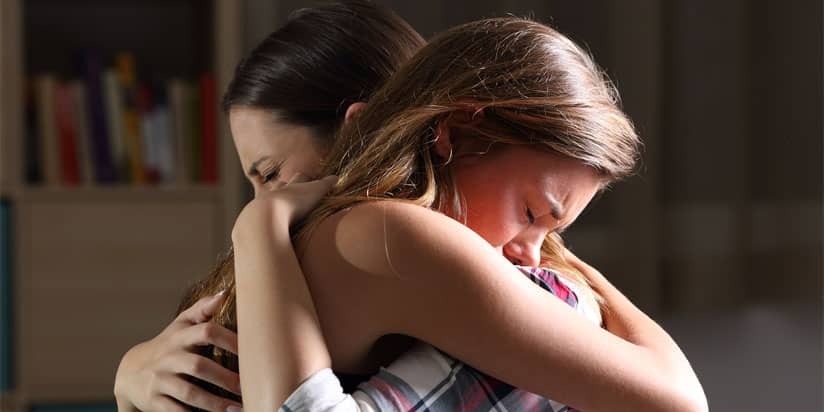 opioid overdose; illustration of embrace of mother and daughter