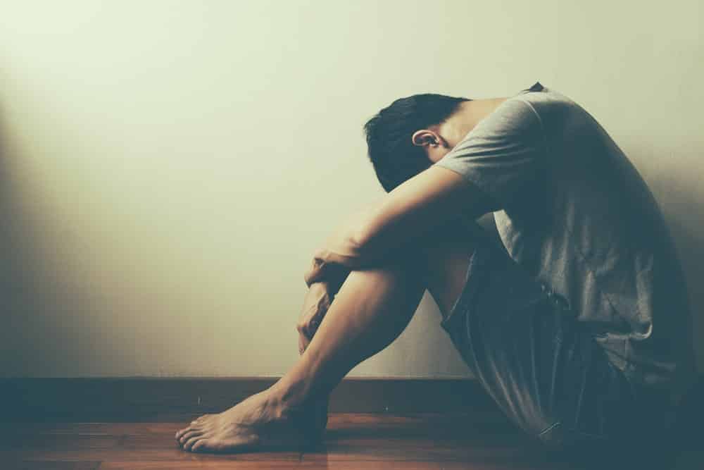 Man sitting alone in dark room