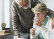 senior male comforts senior female pain patient taking prescription opioids with new FDA guidelines for discontinuation