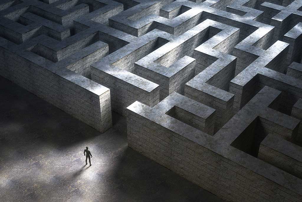 Concept of ethics in addiction treatment: Small man entering a huge mysterious maze.