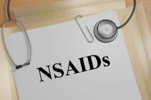 3D illustration of "NSAIDs" title on a medical document - concept of understanding the interaction of Tramadol and Ibuprofen for pain management