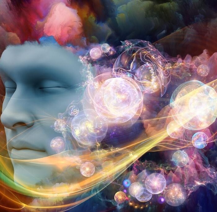 Image of an arrangement of human face and colorful fractal clouds on the subject of dreams mind spirituality imagination and inner world - concept of crazy dreams in early sobriety.