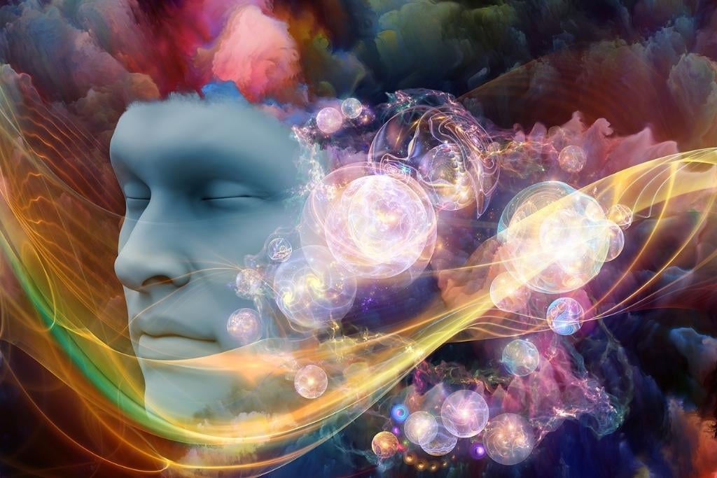 Image of an arrangement of human face and colorful fractal clouds on the subject of dreams mind spirituality imagination and inner world - concept of crazy dreams in early sobriety.